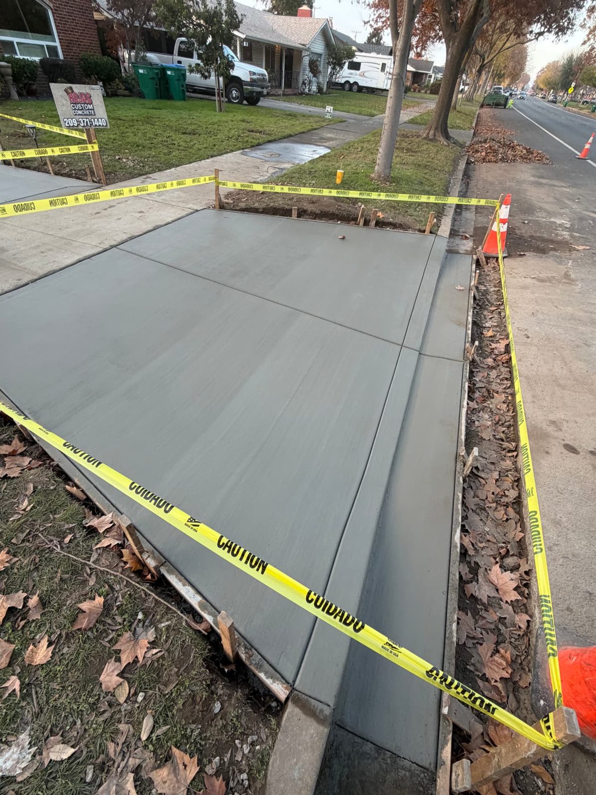 New concrete sidewalk and driveway approach